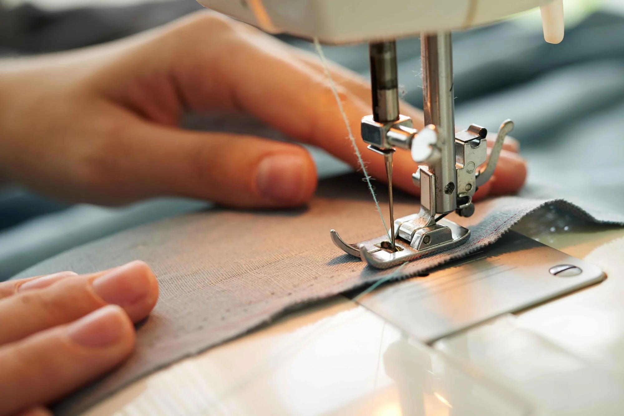 Sewing machine stitching fabric